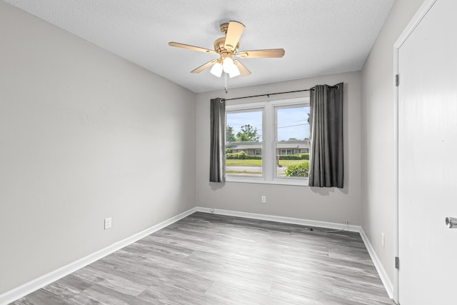4360 Beau Terra Ln, Pensacola, FL 32514 - empty room with a textured ceiling, light wood-type flooring, ceiling fan, and baseboards