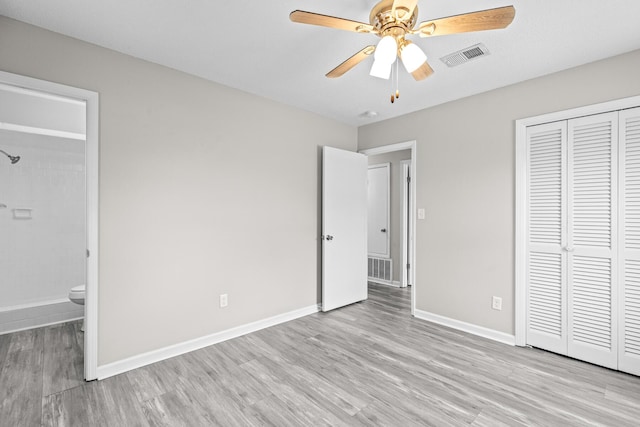 4360 Beau Terra Ln, Pensacola, FL 32514 - unfurnished bedroom featuring light wood-type flooring, a closet, baseboards, connected bathroom, and a ceiling fan
