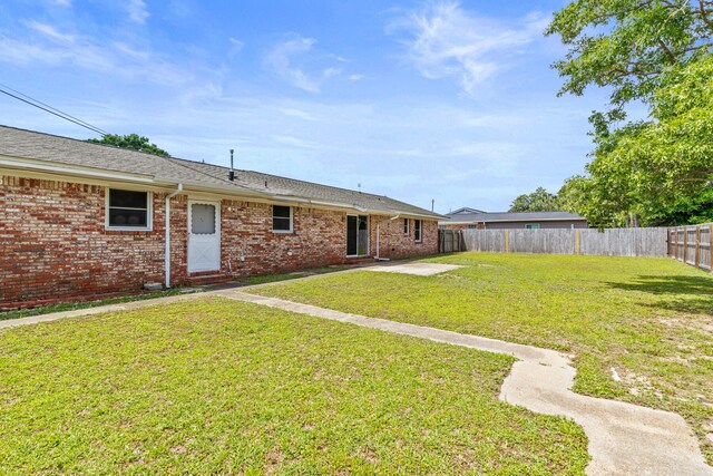 4360 Beau Terra Ln, Pensacola, FL 32514 - back of house with brick siding and a patio area