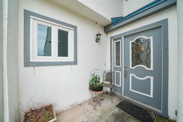 7118 Singleton Cir Unit A, Panama City, FL 32404 - doorway to property featuring stucco siding