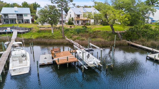 7118 Singleton Cir Unit A, Panama City, FL 32404 - dock featuring a water view, a yard, and boat lift