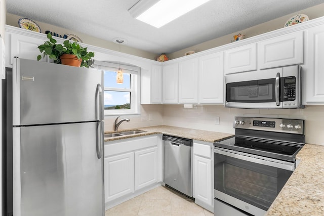 11 Beachside Dr Unit 613, Santa Rosa Beach, FL 32459 - kitchen featuring appliances with stainless steel finishes, a sink, white cabinetry, and light countertops