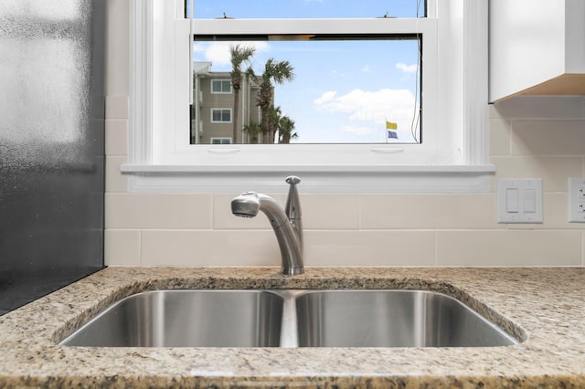11 Beachside Dr Unit 613, Santa Rosa Beach, FL 32459 - kitchen view of a sink, decorative backsplash, and light stone countertops