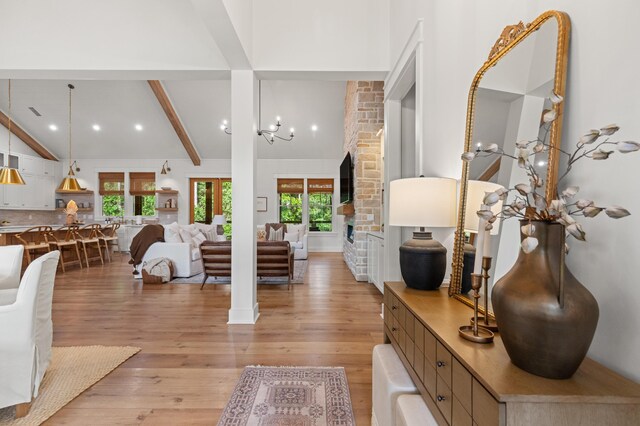 foyer entrance featuring light wood finished floors and healthy amount of natural light