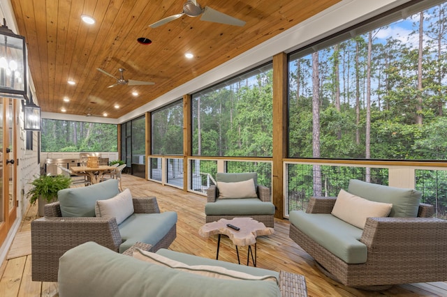 sunroom / solarium with a ceiling fan, outdoor lounge area, and healthy amount of natural light