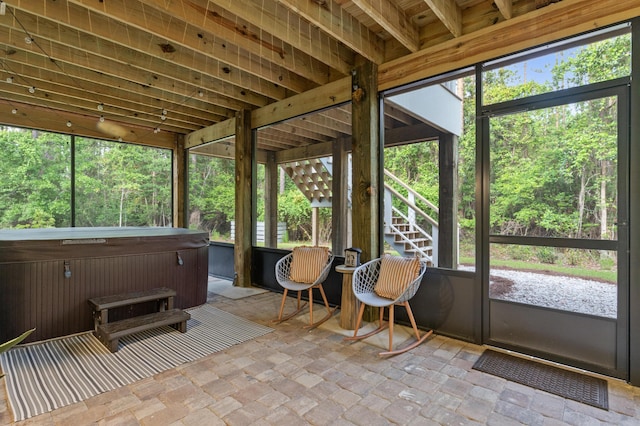 sunroom / solarium featuring a jacuzzi
