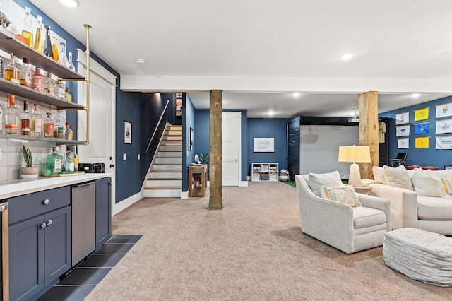 living area featuring bar with sink, stairway, recessed lighting, and dark carpet