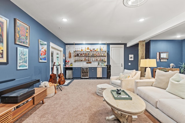 living room featuring wine cooler, wet bar, recessed lighting, and carpet flooring