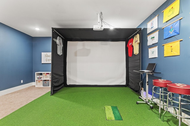 game room featuring golf simulator, carpet floors, and baseboards