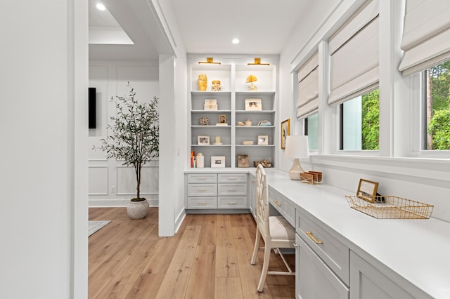 bathroom featuring hardwood / wood-style flooring and recessed lighting