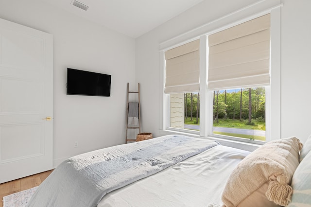 bedroom with wood finished floors