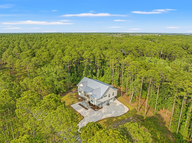 view from above of property with a forest