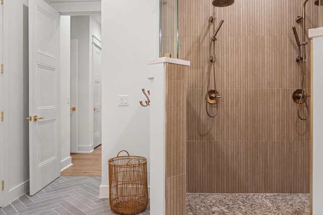 full bath featuring a tile shower