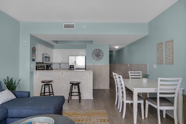 1200 Scenic Gulf Dr Unit B507, Miramar Beach, FL 32550 - dining area featuring wood finished floors