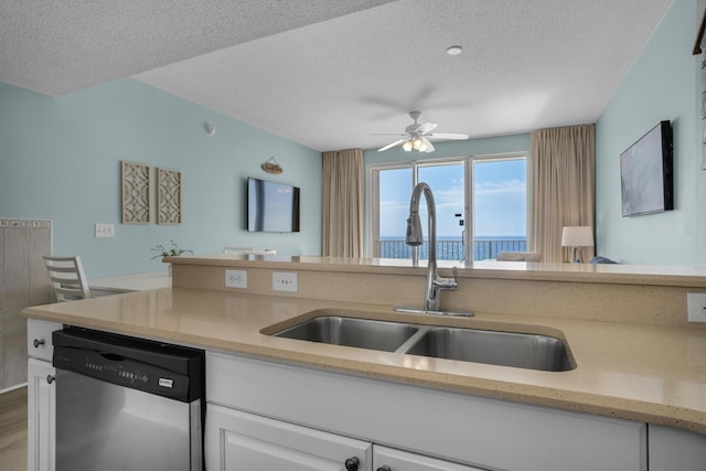 1200 Scenic Gulf Dr Unit B507, Miramar Beach, FL 32550 - kitchen with dishwasher, a sink, a textured ceiling, white cabinets, and ceiling fan