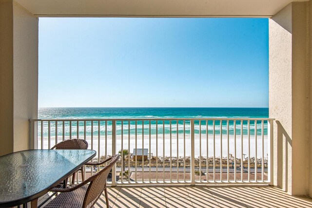 1200 Scenic Gulf Dr Unit B507, Miramar Beach, FL 32550 - balcony featuring view of water and beach and outdoor dining space