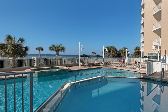 1200 Scenic Gulf Dr Unit B507, Miramar Beach, FL 32550 - view of pool with a pool with connected hot tub, fence, and a patio area