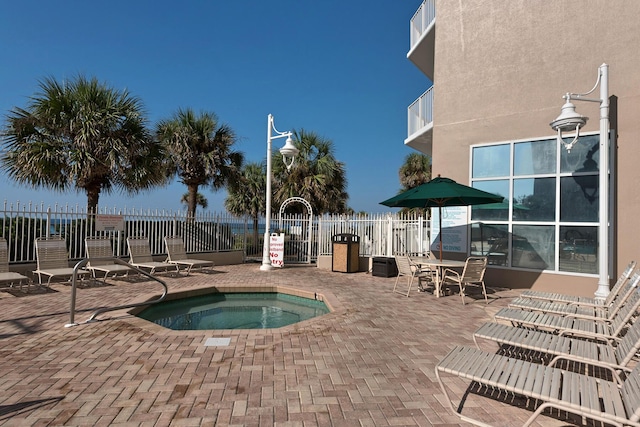1200 Scenic Gulf Dr Unit B507, Miramar Beach, FL 32550 - view of pool featuring fence, a community hot tub, and a patio area