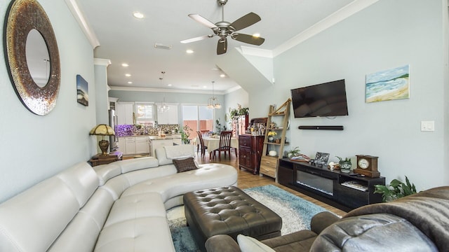 995 Airport Rd Unit 28, Destin, FL 32541 - living area featuring ornamental molding, ceiling fan, wood finished floors, recessed lighting, and a chandelier