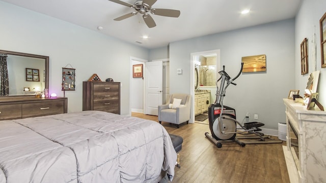 995 Airport Rd Unit 28, Destin, FL 32541 - bedroom featuring wood finished floors, recessed lighting, baseboards, a ceiling fan, and ensuite bathroom