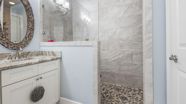 995 Airport Rd Unit 28, Destin, FL 32541 - bathroom featuring walk in shower and vanity