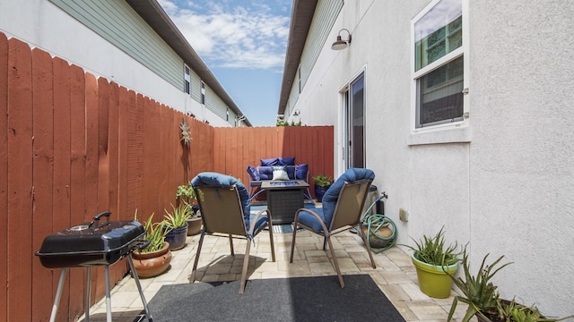 995 Airport Rd Unit 28, Destin, FL 32541 - view of patio with fence and a grill