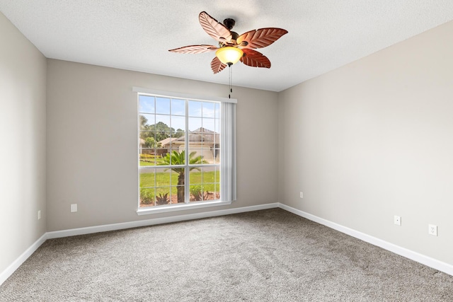123 Bonaire Blvd, Miramar Beach, FL 32550 - spare room featuring a ceiling fan, carpet flooring, baseboards, and a textured ceiling