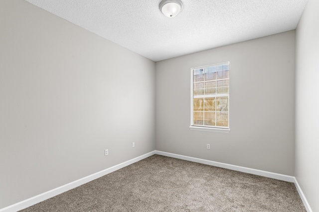 123 Bonaire Blvd, Miramar Beach, FL 32550 - carpeted spare room with baseboards and a textured ceiling