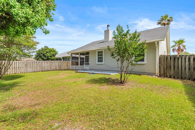 123 Bonaire Blvd, Miramar Beach, FL 32550 - rear view of house featuring a chimney, stucco siding, a sunroom, and roof with shingles
