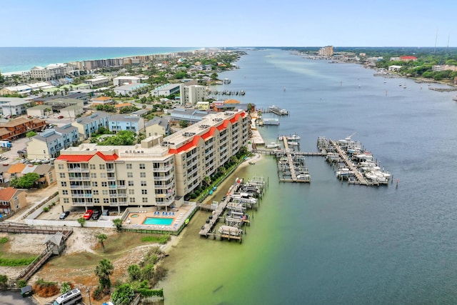 bird's eye view of a nearby body of water and apartment complex / building