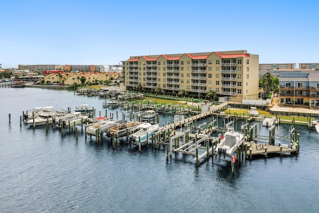 dock with boat lift, a water view, and view of marina