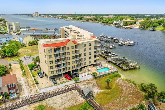 aerial view of a nearby body of water and apartment complex / building
