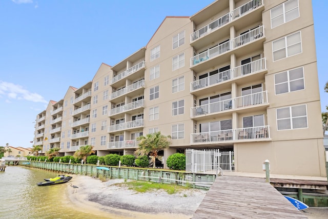 view of apartment building / complex featuring a water view