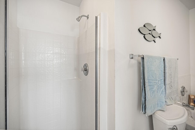 full bath featuring a shower and toilet