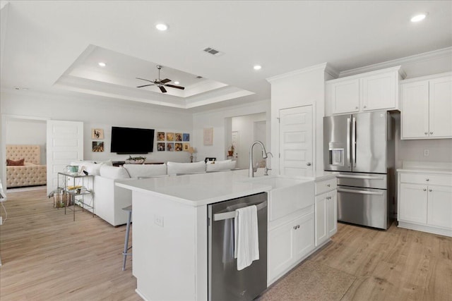 613 Las Roblas Grande Dr, Santa Rosa Beach, FL 32459 - kitchen featuring stainless steel appliances, crown molding, ceiling fan, light wood-style flooring, and light countertops