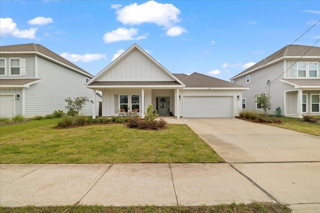 613 Las Roblas Grande Dr, Santa Rosa Beach, FL 32459 - view of front of property with board and batten siding, a garage, driveway, a front yard, and a porch