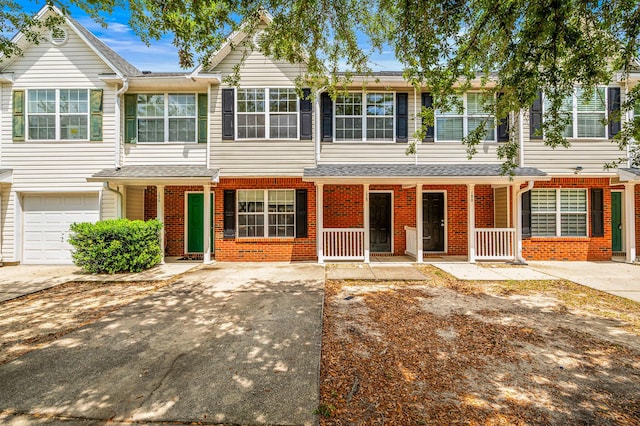 178 Swaying Pine Ct, Crestview, FL 32539 - view of property with brick siding, driveway, and a garage