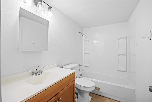 bathroom featuring toilet, tile patterned flooring, vanity, and shower / tub combination