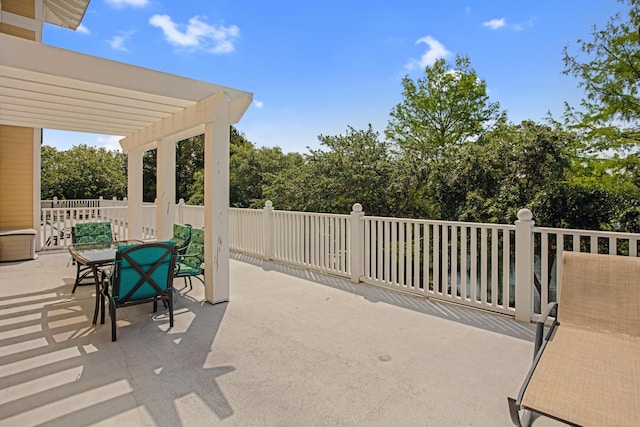 view of patio / terrace featuring a pergola and outdoor dining space