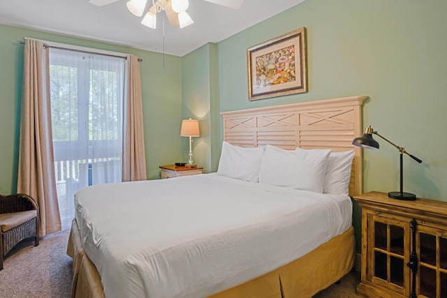 carpeted bedroom featuring access to outside and a ceiling fan