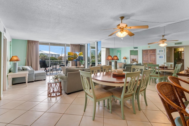 30 Moreno Point Rd Unit 206B, Destin, FL 32541 - dining area with a textured ceiling, floor to ceiling windows, light tile patterned floors, and ceiling fan