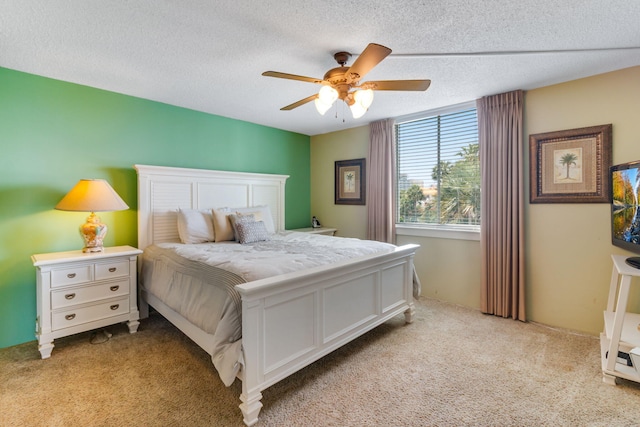30 Moreno Point Rd Unit 206B, Destin, FL 32541 - bedroom featuring light colored carpet, a textured ceiling, and a ceiling fan
