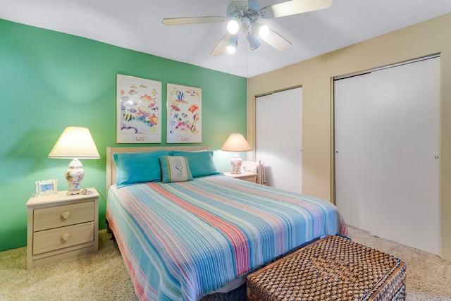 30 Moreno Point Rd Unit 206B, Destin, FL 32541 - carpeted bedroom featuring a ceiling fan and multiple closets