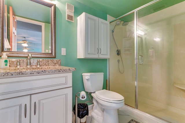 30 Moreno Point Rd Unit 206B, Destin, FL 32541 - full bathroom with toilet, a shower stall, vanity, and ceiling fan