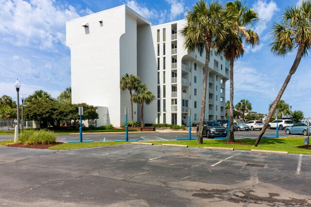 30 Moreno Point Rd Unit 206B, Destin, FL 32541 - view of building exterior with uncovered parking