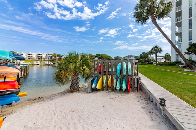30 Moreno Point Rd Unit 206B, Destin, FL 32541 - dock area with a water view and a yard