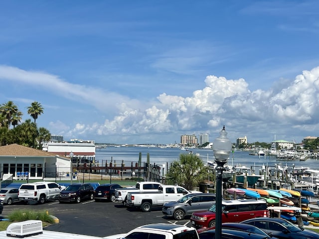 30 Moreno Point Rd Unit 206B, Destin, FL 32541 - uncovered parking lot with a water view
