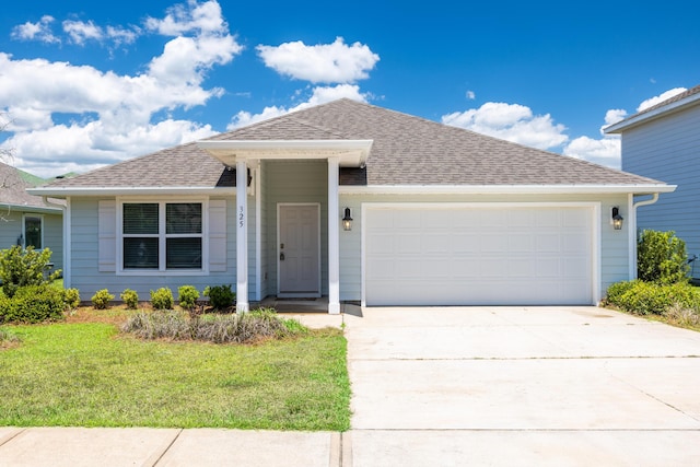 ranch-style home with a garage, a front yard, driveway, and a shingled roof