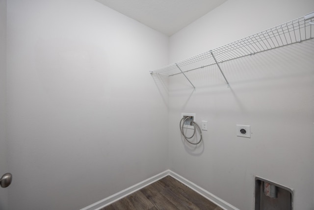 washroom with hookup for a washing machine, dark wood-type flooring, baseboards, and electric dryer hookup