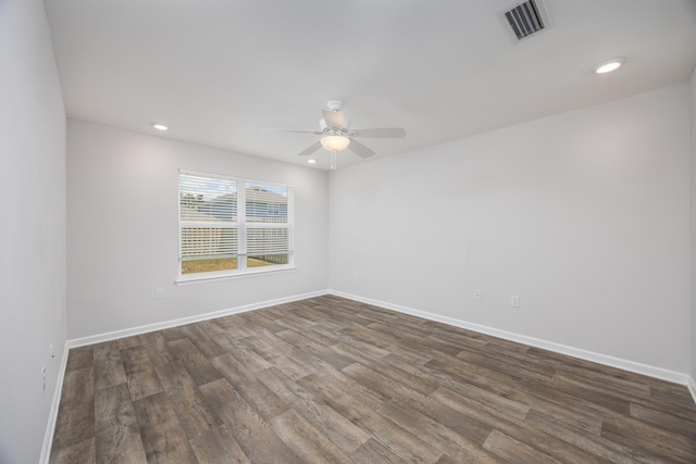 unfurnished room featuring a ceiling fan, dark wood finished floors, baseboards, and recessed lighting